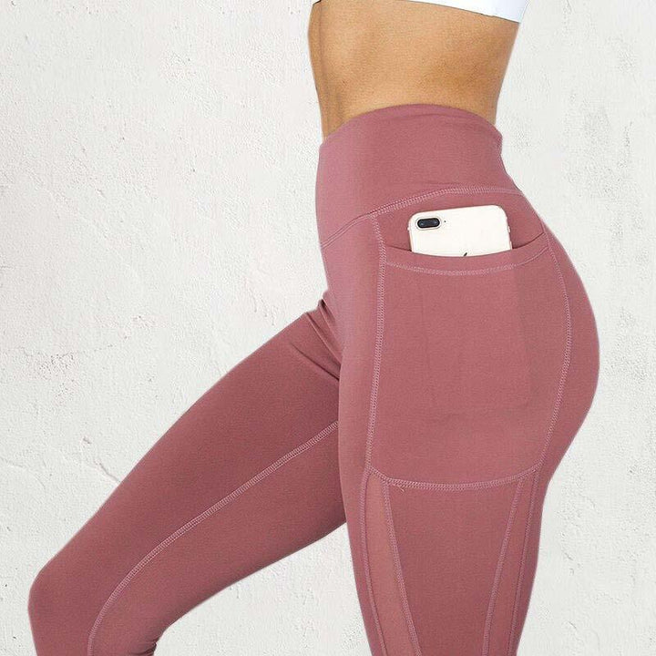 Kvinnors Högmidjade Kompressionsgymleggings – Stretchaktiva Kläder med Sidoficka